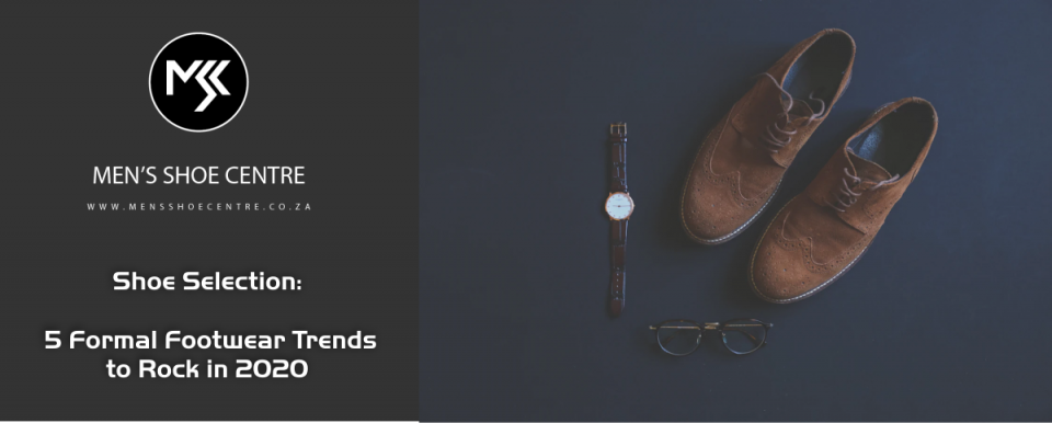 a flat layout of brown formal shoes, spectacles and leather-strap watch